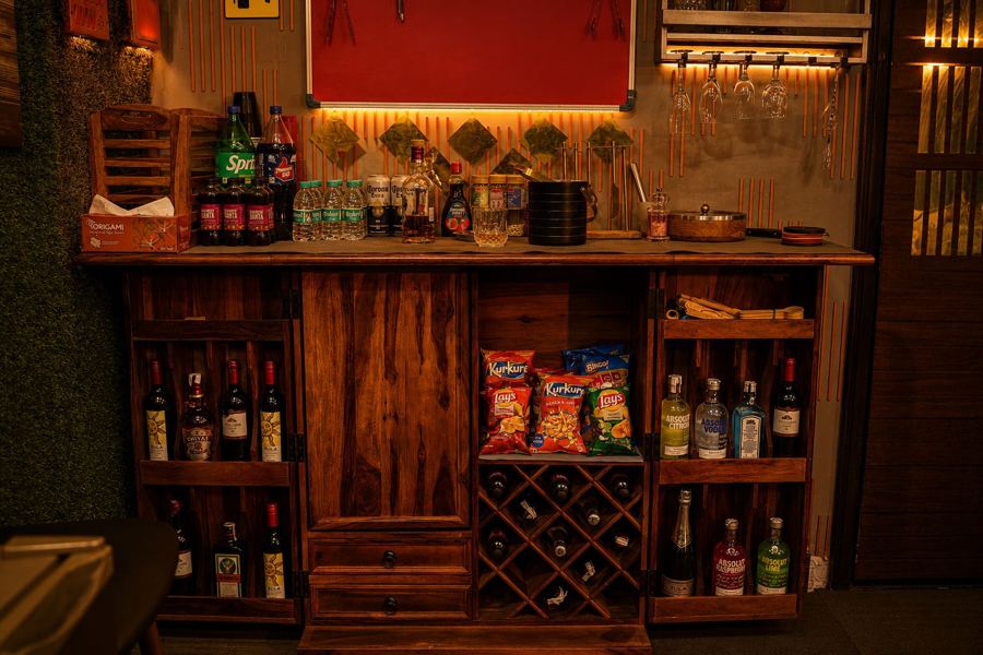 Wooden home bar counter with shelves
